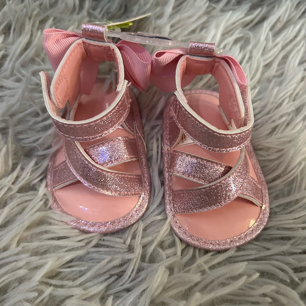 New with tags “First steps” Glittery Pink Kids Sandals. Size 1.